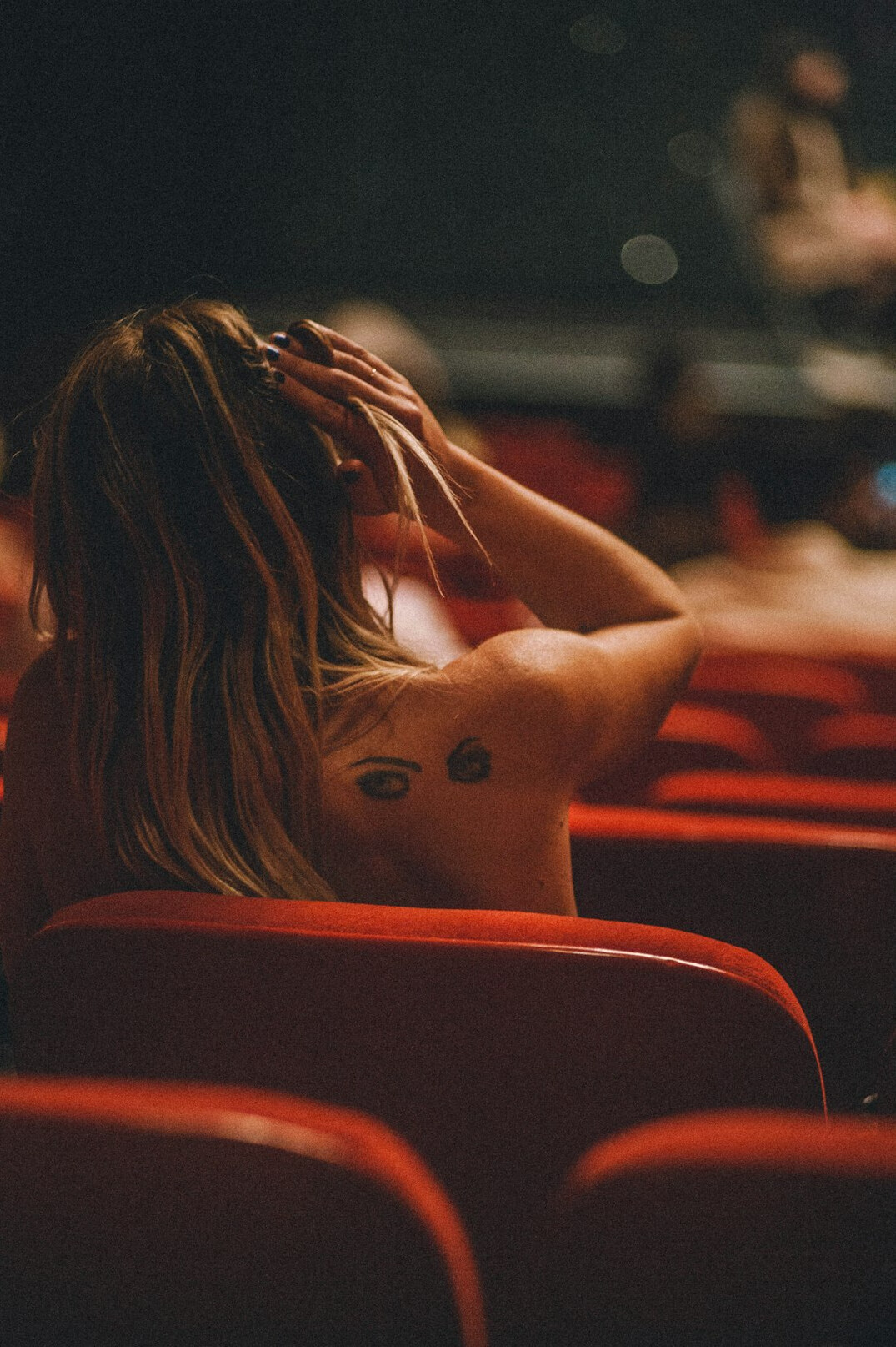 Empty cinema theatre with red seats